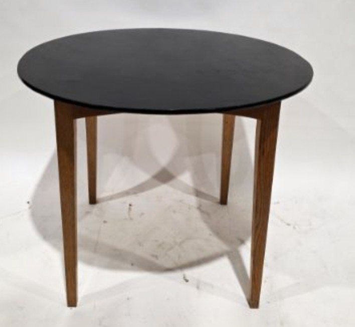 dining table with black top, on an oak base