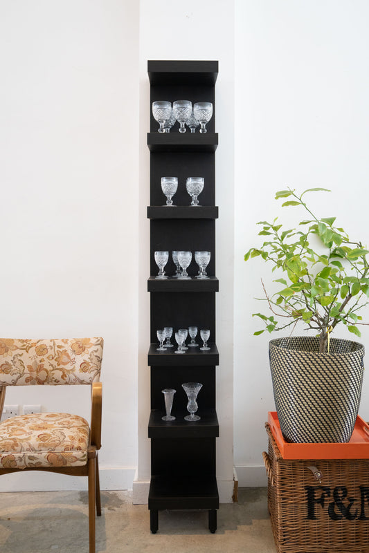 Tall black shelving unit