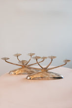 Load image into Gallery viewer, A pair of four pronged silver plated candelabras