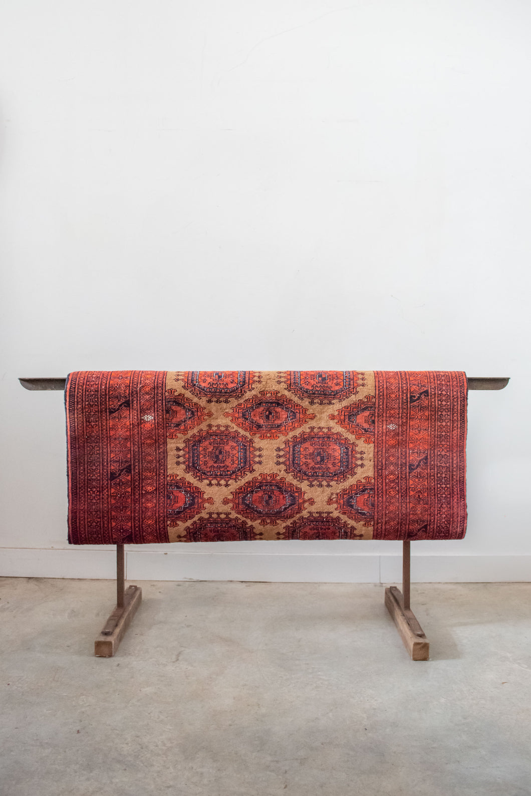 Beluch Rug brown background with orange and black pattern
